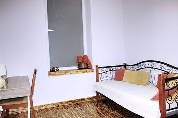 Bright and cozy living room of Flora’s Memories Apartment in central Kavala.