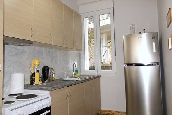 Bright and cozy living room of Flora’s Memories Apartment in central Kavala.